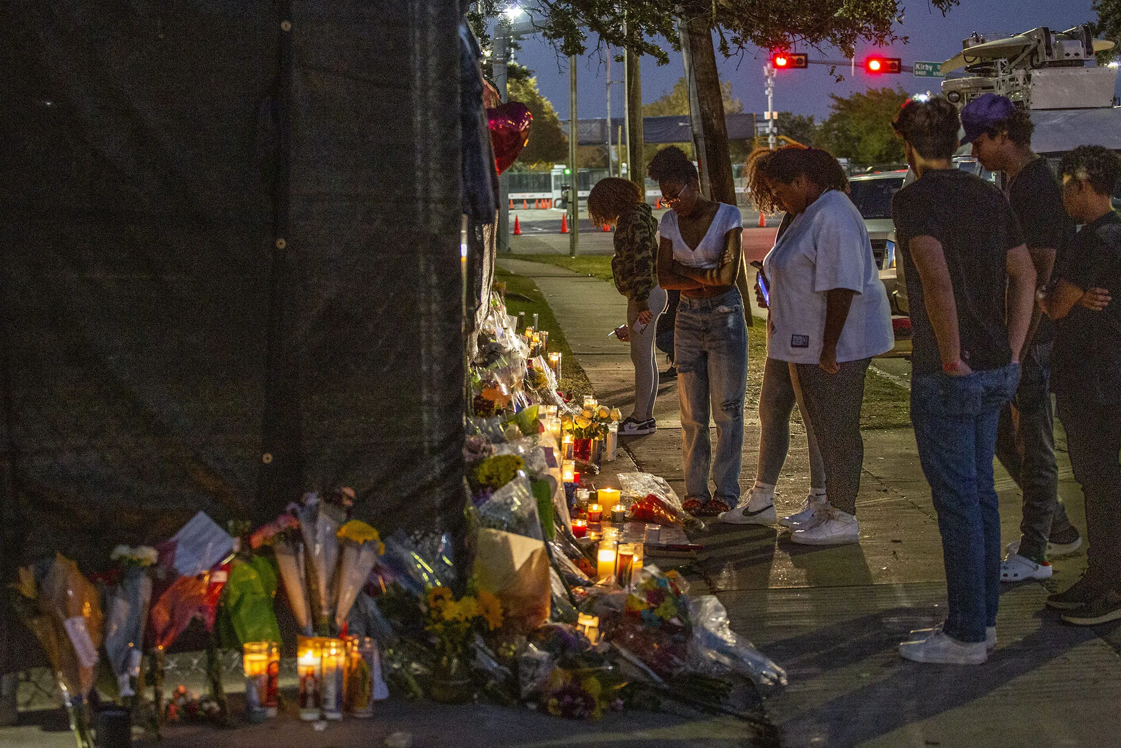 People attend a makeshift memorial on November 7, 2021 at the NRG Park grounds where eight people died in a crowd surge at the Astroworld Festival in Houston, Texas.&nbsp;