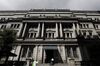 A man enters the Bank of Japan (BOJ) headquarters in Tokyo, Japan, on Tuesday, July 31, 2018. The central bank left its key interest rates unchanged while announcing policy tweaks, including a shift in purchases of exchange-traded funds toward assets linked to the Topix equities index and flexibility in bond operations.