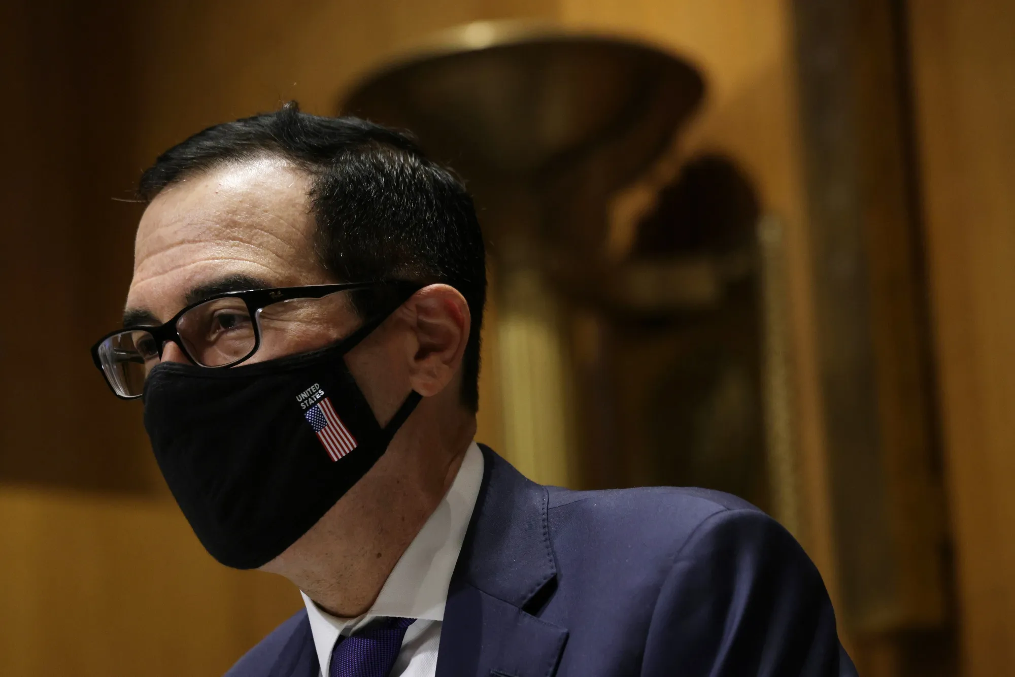 Steven Mnuchin arrives to a&nbsp;Congressional Oversight Committee hearing on Dec. 10.&nbsp;