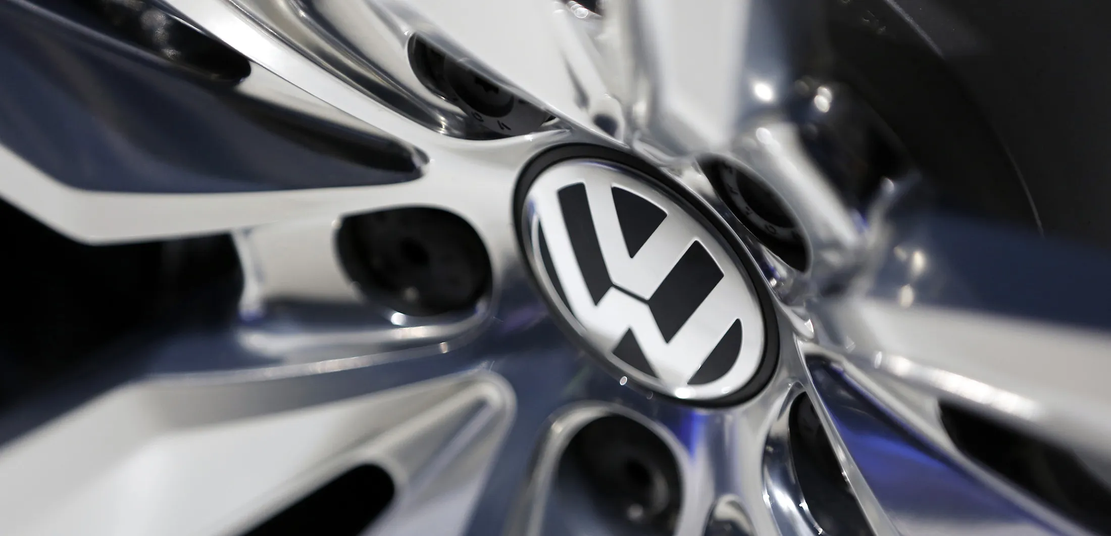 A VW logo sits on the alloy wheel of a Volkswagen automobile, produced by Volkswagen AG.
