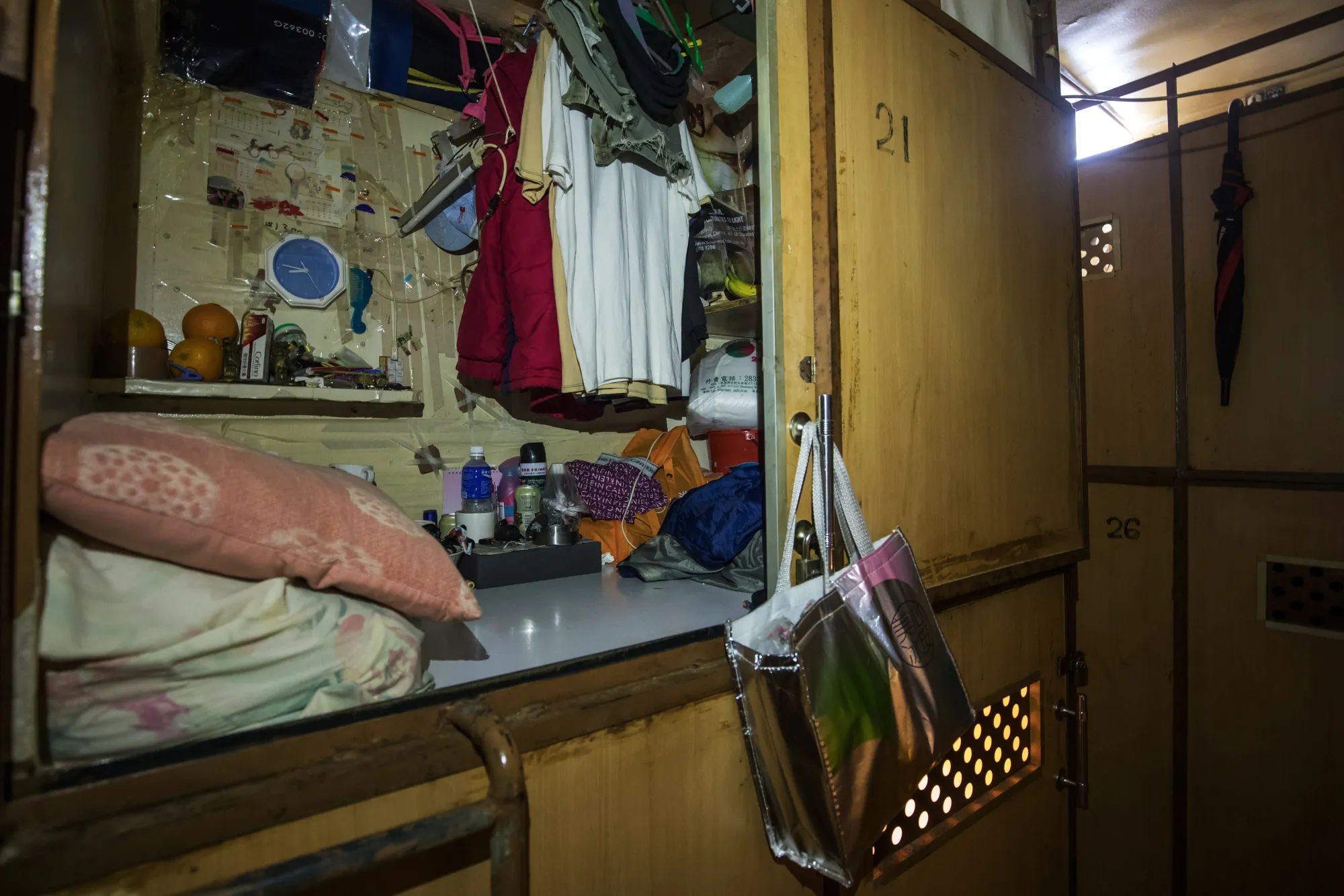 An occupant's possessions inside a subdivided residential unit, known as a "cage home", in Hong Kong.
