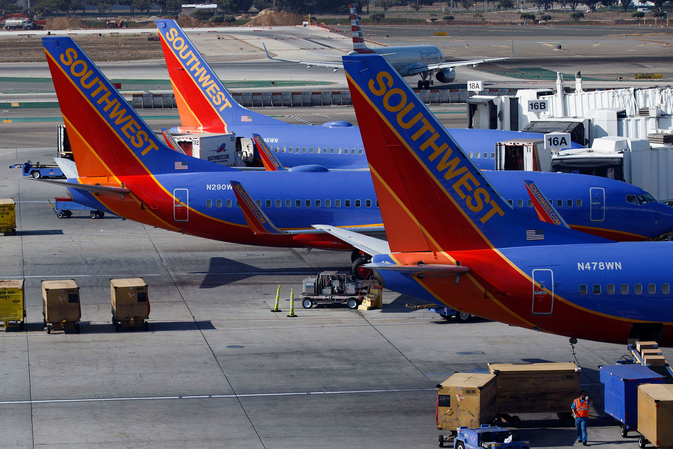 Southwest Airlines Co. Boeing 737 aircraft stand at their gates at Terminal 1 of Los Angeles International Airport (LAX) in Los Angeles, California, U.S., on Tuesday, August 18, 2015.
