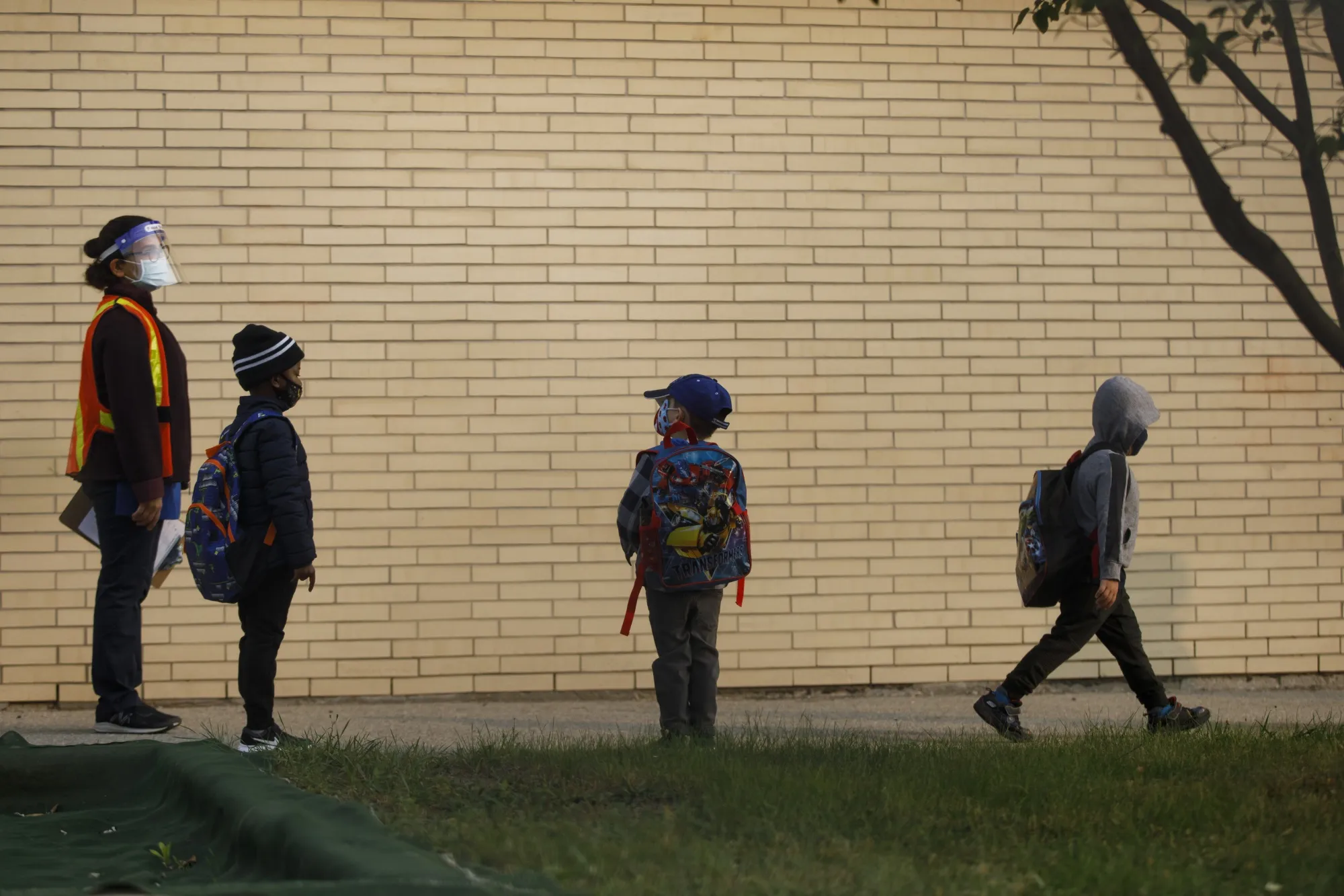 Kindergarten students arrive at a Toronto school in September 2020..
