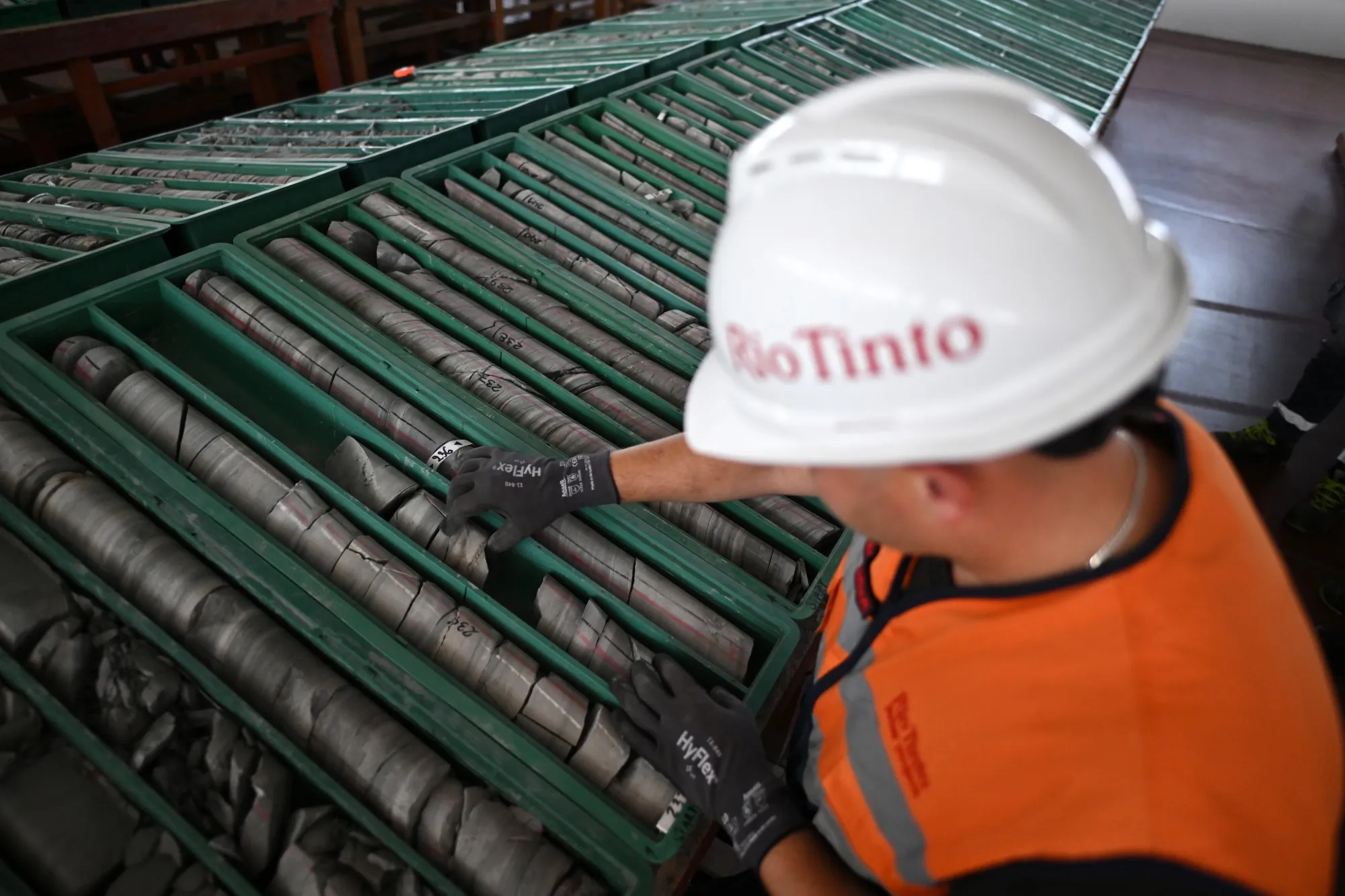 An employee works on sample trays of jadarite, containing lithium and borate, at the Rio Tinto Group research center in Loznica, Serbia, on Friday, July 12, 2024.