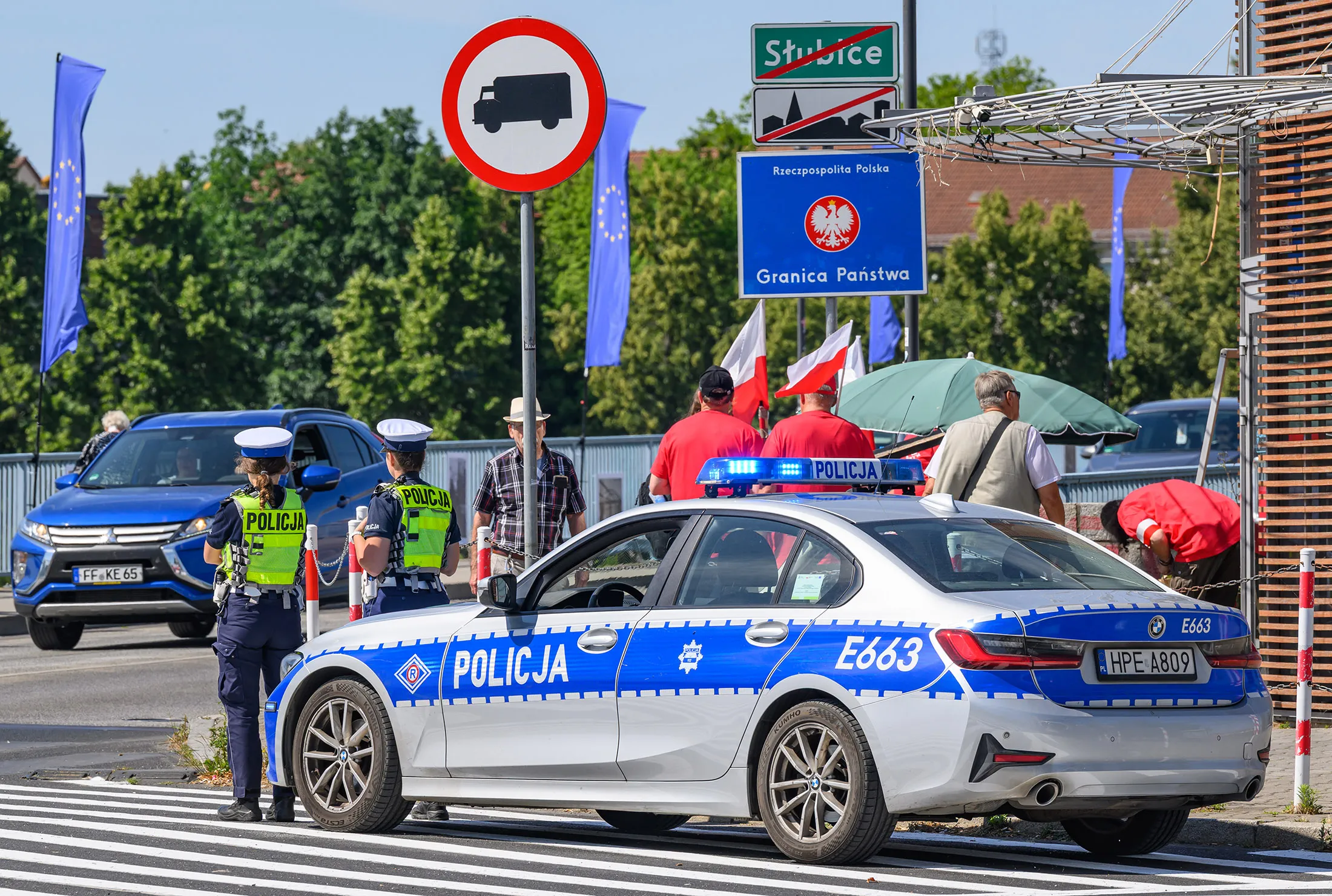 Polish police officers stand at the German-Polish border crossing between Brandenburg, Germany and Slubice, Poland on July 5.