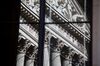 The New York Stock Exchange (NYSE) is reflected in a window of Federal Hall in New York, U.S., on Wednesday, June 17, 2020. U.S. stocks fluctuated as the recent rally begins to show signs of losing momentum amid a worrying increase in coronavirus cases.