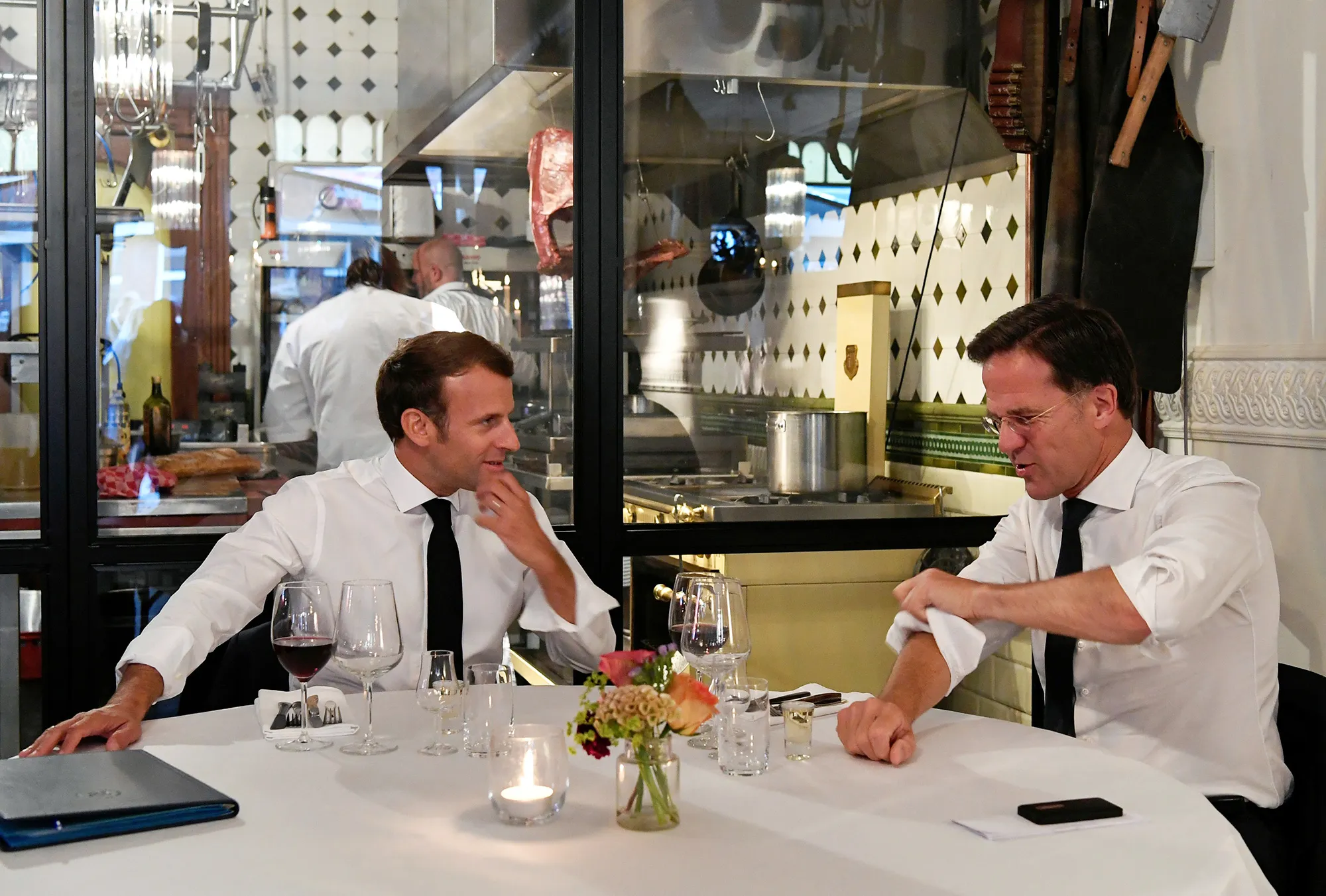 Emmanuel Macron, left, and Mark Rutte dine in The Hague, Netherlands, on June 23.