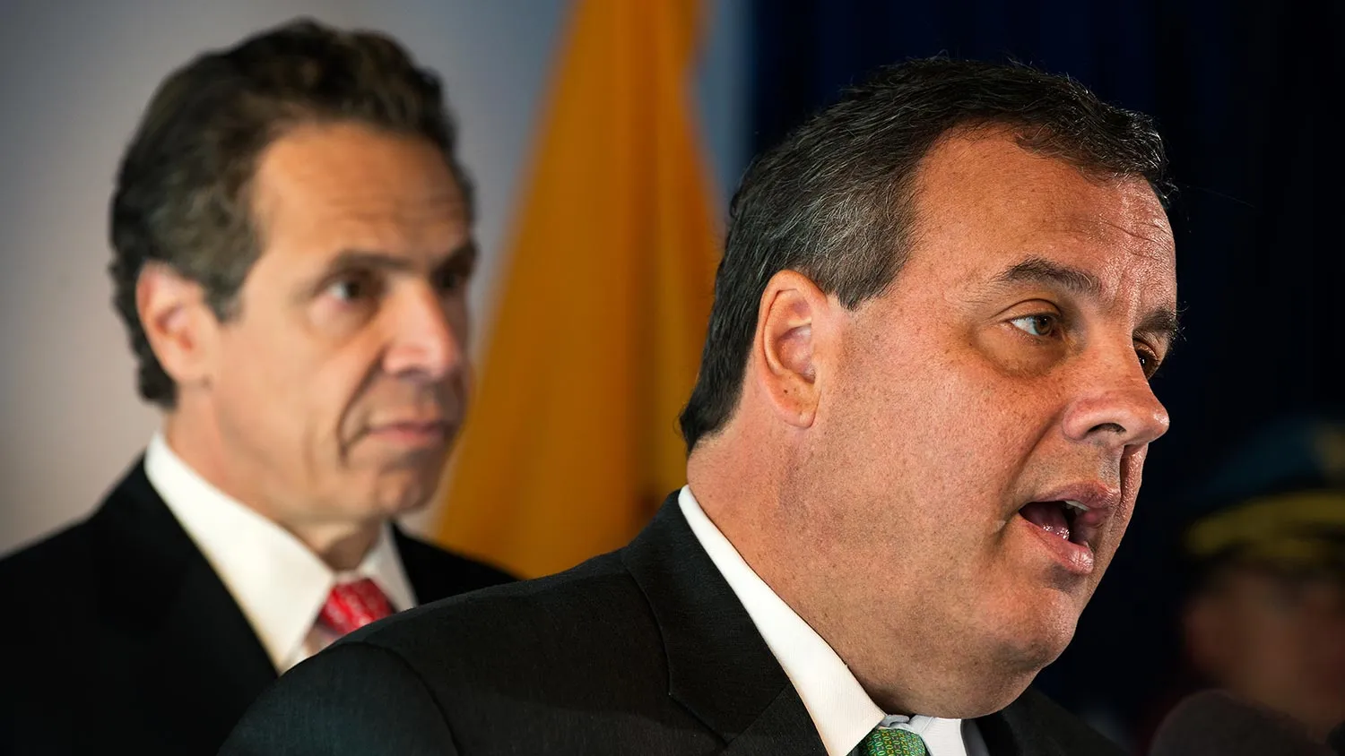 New Jersey Gov. Chris Christie (R) speaks as New York Governor Andrew Cuomo (L) listens, while both announce the initial findings from their joint review of security protocols, in response to growing, global terrorism, for New Jersey and New York during a press conference on September 24, 2014 at 7 World Trade Center in New York, NY.
