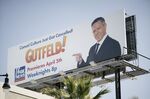 A billboard for Greg Gutfeld’s new show on Fox.