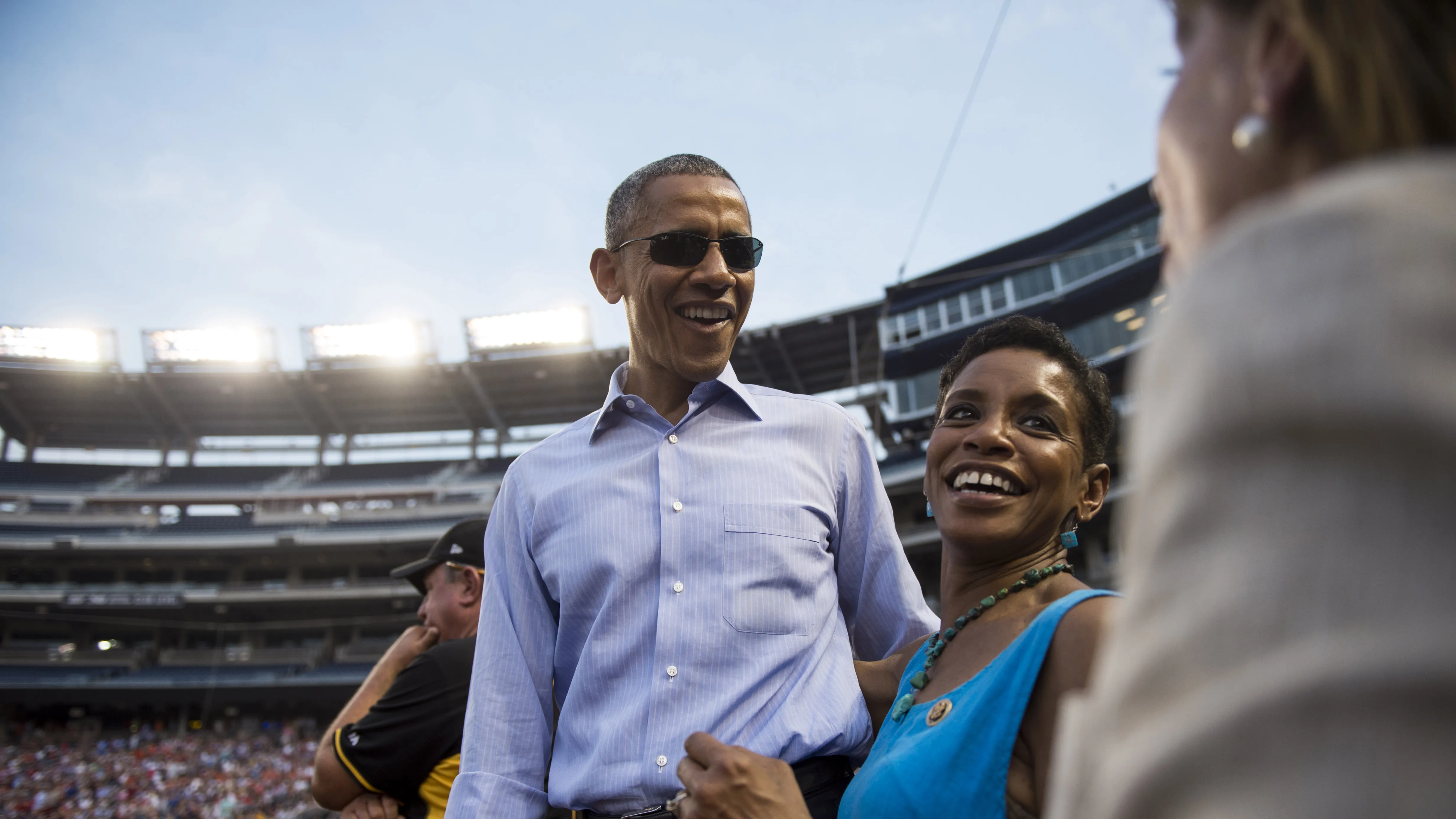 UNITED STATES - JUNE 11: President Barack Obama speaks with Rep. Donna Edwards, D-Md., and House Minority Leader Nancy Pelosi, D-Calif., as he makes a surprise visit to the Democrats' dugout during the 54th Annual Roll Call Congressional Baseball Game at Nationals Park in Washington on Thursday, June 11, 2015. The Democrats beat the Republicans 5-2. (Photo By Bill Clark/CQ Roll Call)
