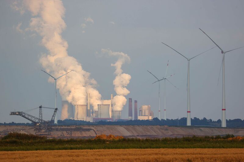 Vapor rises from RWE AG’s Niederaussem coal plant. RWE this month warned that coal plants may close earlier than planned.