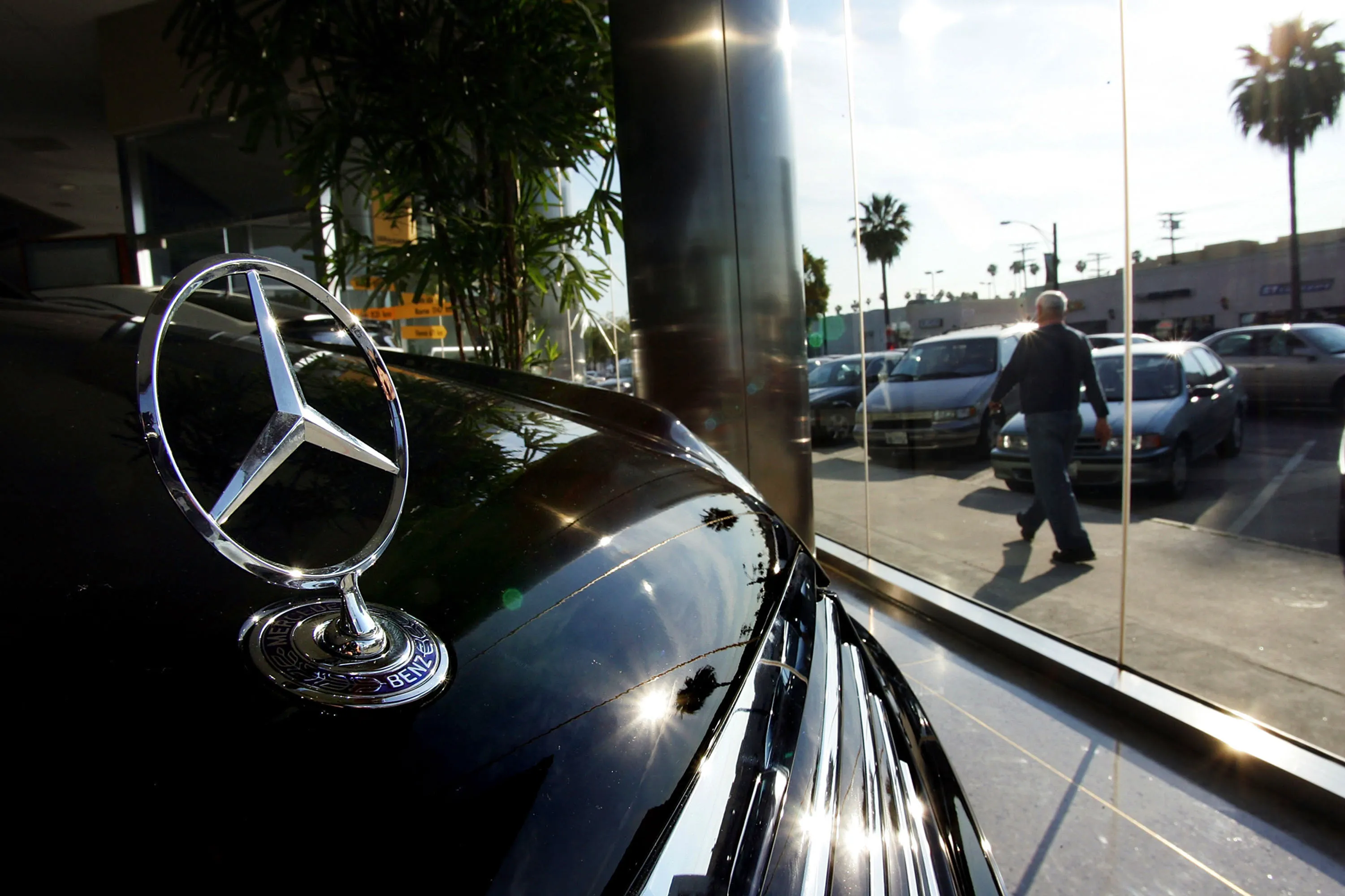 A pedestrian walks past a Mercedes-Benz dealership&nbsp;in Glendale, California.&nbsp;