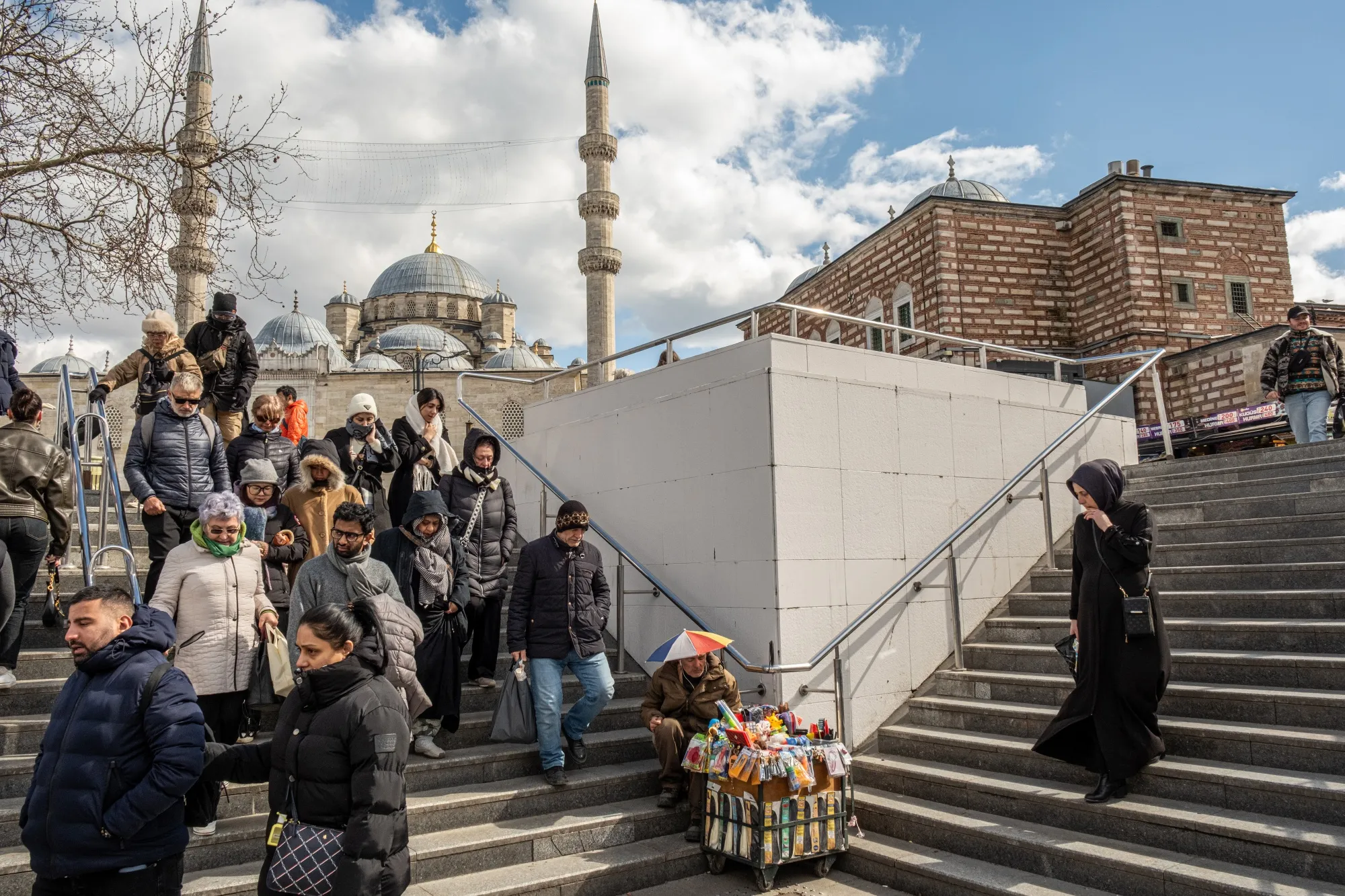 Pedestrians near the Yeni Camii mosque in Istanbul, Turkey.