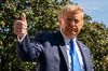 U.S. President Donald Trump gives a thumbs up to members of the media before boarding Marine One on the South Lawn of the White House in Washington, D.C., U.S., on Thursday, Oct. 15, 2020. Trump said he'd support a virus relief package in excess of $1.8 trillion -- his administration's most recent negotiating proposal -- and blamed House Speaker Nancy Pelosi for delaying a deal.