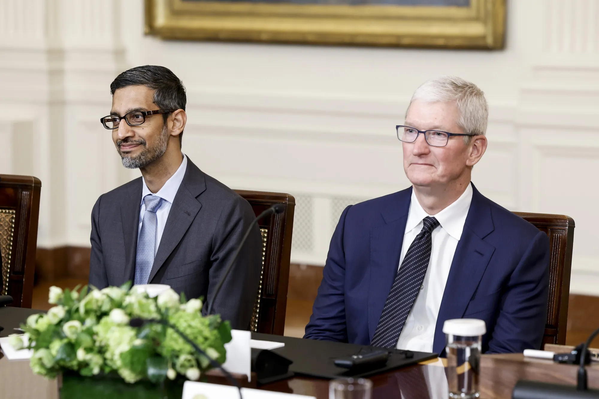 Sundar Pichai and Tim Cook.
