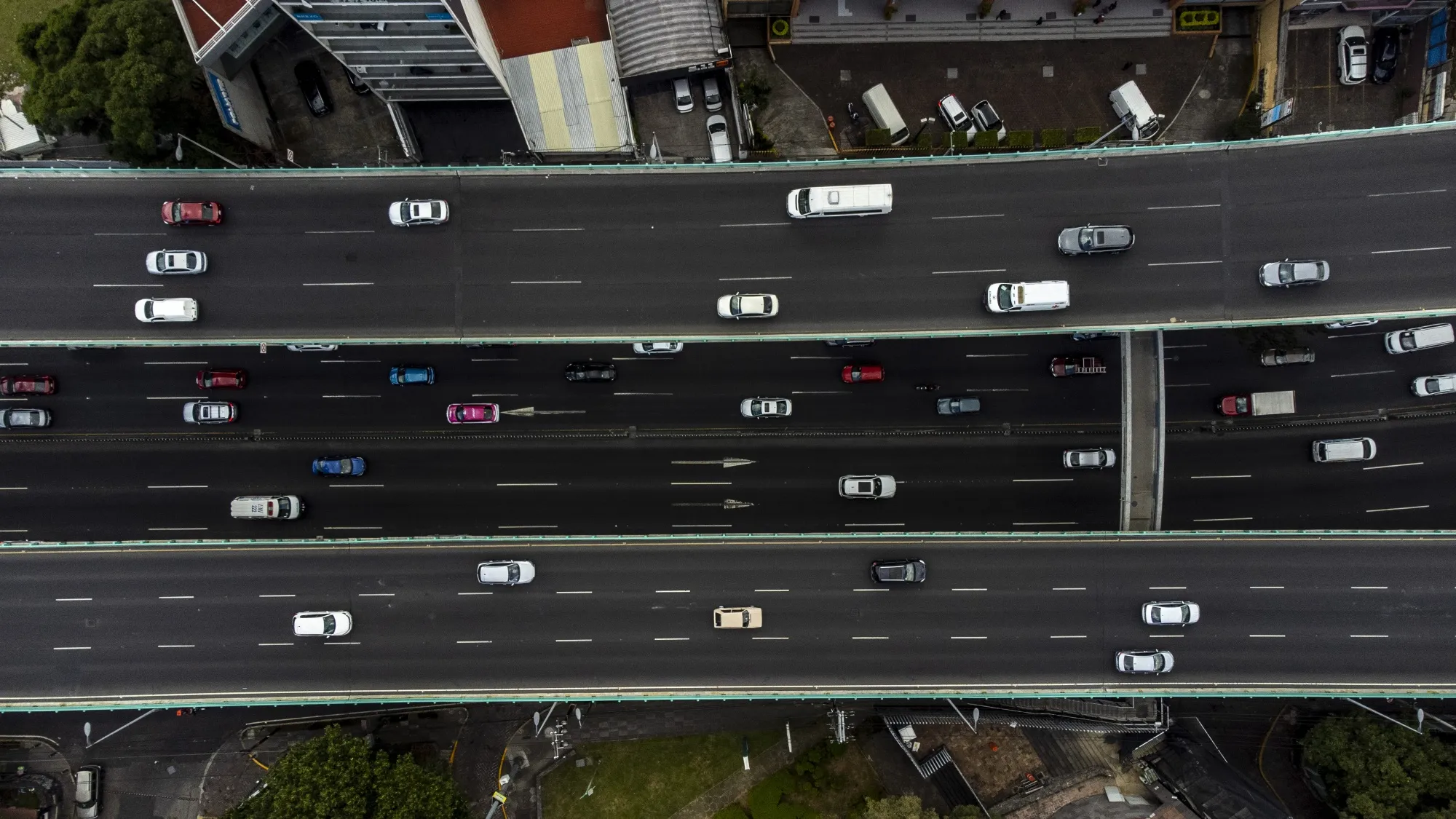 Vehicles travel along elevated highways in Mexico City, Mexico.