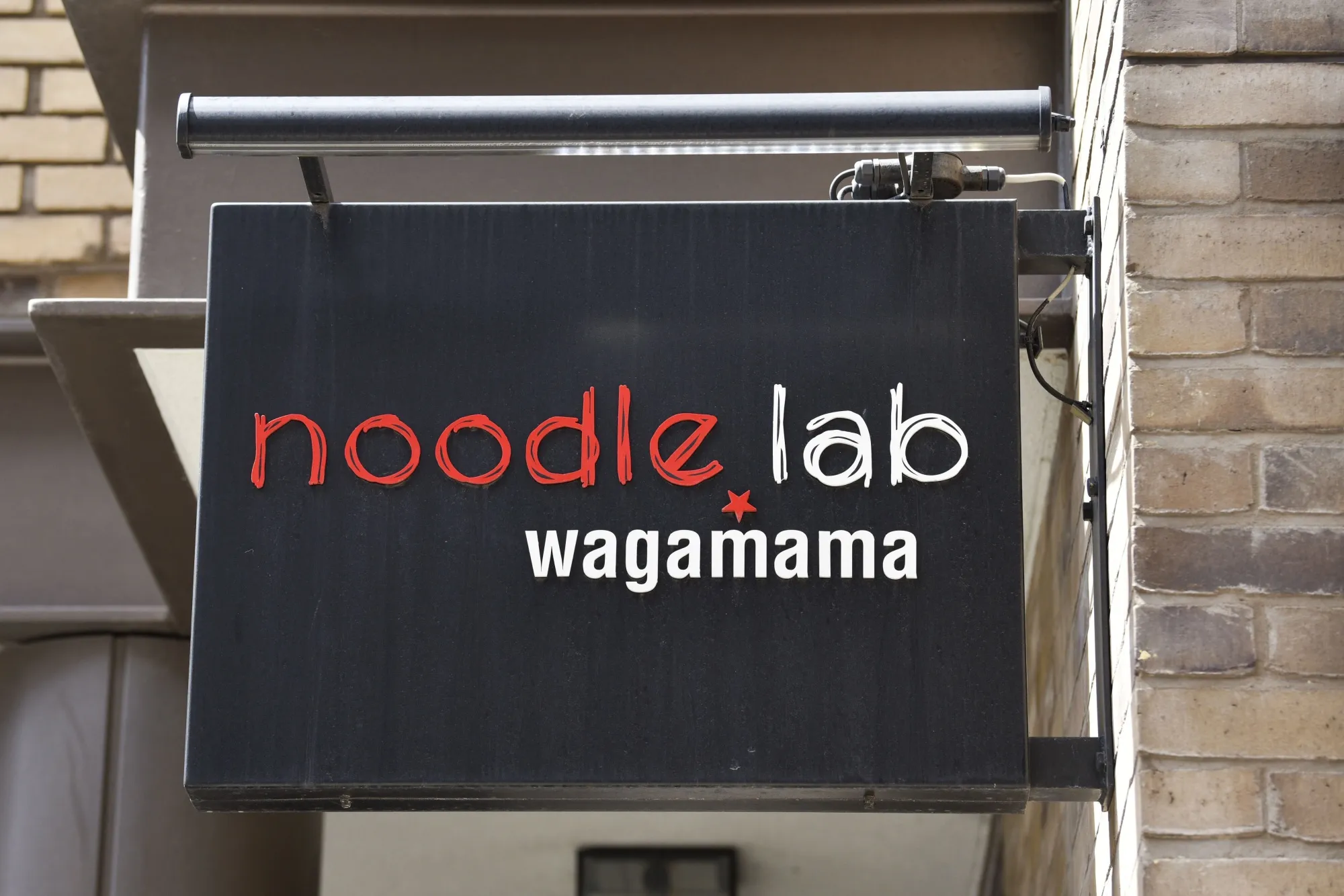 Noodle Lab Wagamama signage at their restaurant in Soho.