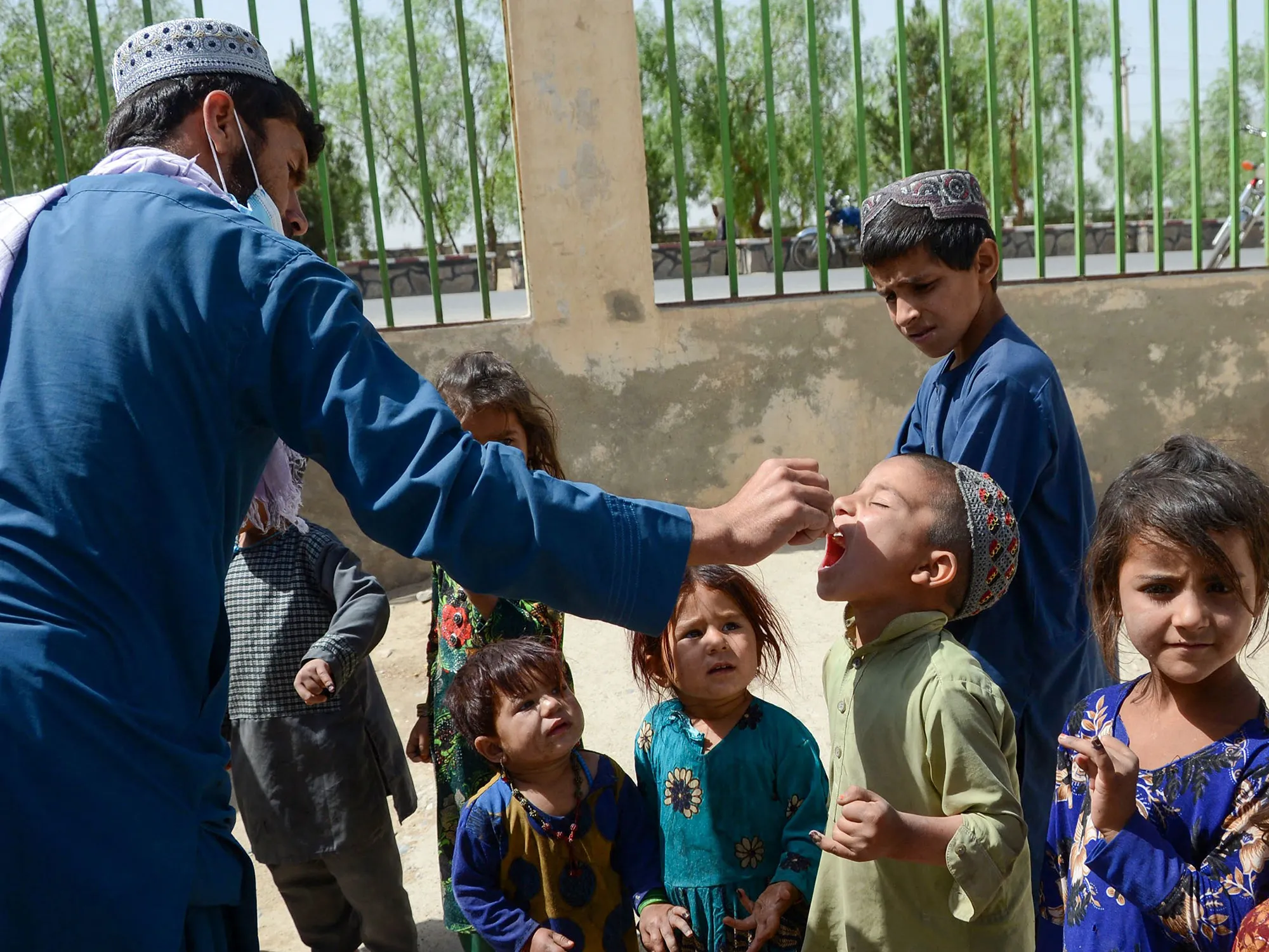 A health worker administers polio vaccine drops to a child during a polio vaccination campaign in Kandahar,&nbsp;Afghanistan on May 23.