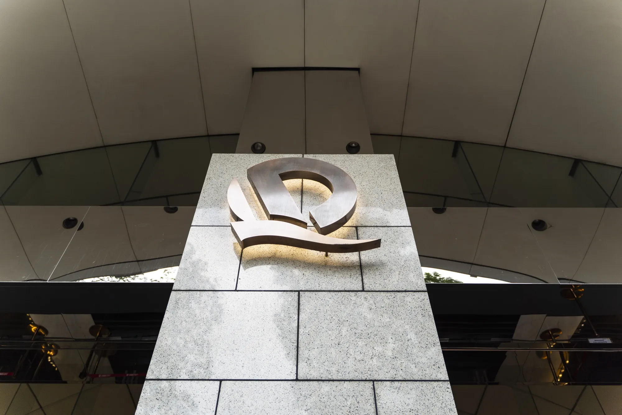 The China Evergrande Group logo is displayed in front of the China Evergrande Centre in Hong Kong, China, on Friday, Sept. 25, 2020. China Evergrande Group is facing a crisis of confidence among creditors who've lent the world's most indebted developer more than $120 billion.