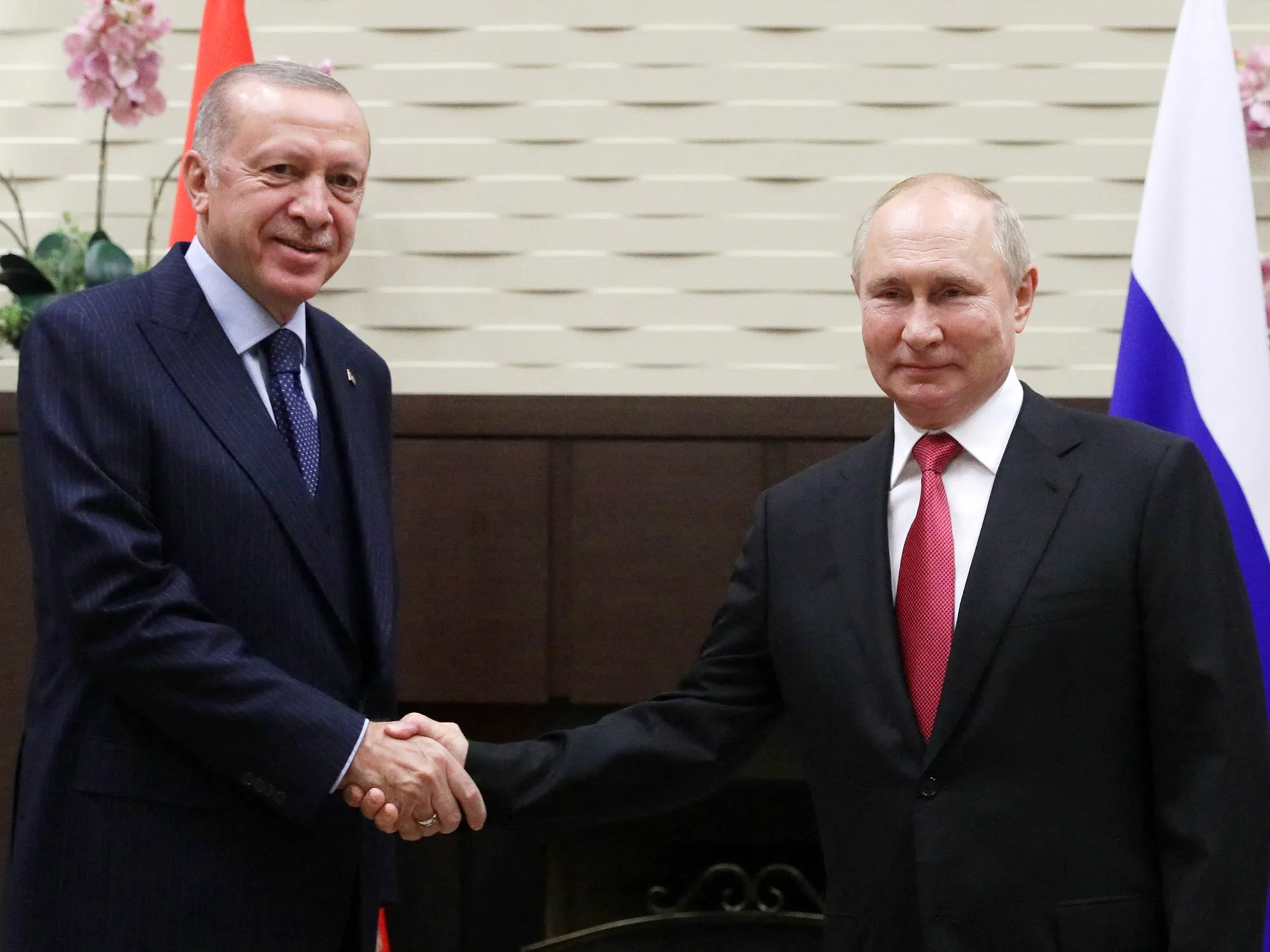 Vladimir Putin, right, greets Recep Tayyip Erdogan in Sochi, Russia, on Sept. 29. 