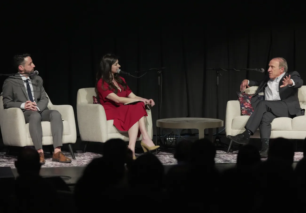 Joe Weisenthal (left), Tracy Alloway (center) and Blair Levin&nbsp;at a taping of the Odd Lots podcast in Washington, DC, on March 12, 2025