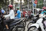 Motorcyclists sit in traffic in Ho Chi Minh City, Vietnam on Wednesday, Jan. 10, 2018. A global trade recovery and Vietnam’s young and low-cost workforce have been magnets for international investors like Nestle SA, which have opened factories in the country this year. That’s helping underpin its economy, which expanded 6.8 percent in 2017, among the fastest in the world.