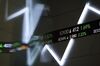 An electronic ticker board displays stock prices inside the Indonesia Stock Exchange (IDX) in Jakarta, Indonesia, on Thursday, Dec. 17, 2015. Stocks and the dollar climbed, while Treasuries clawed back some gains as the first U.S. interest-rate increase in almost a decade was welcomed across Asian markets.