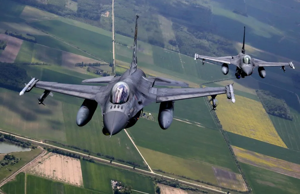 Portuguese Air Force F-16 military fighter jets participate in a NATO excercise in Lithuanian airspace.