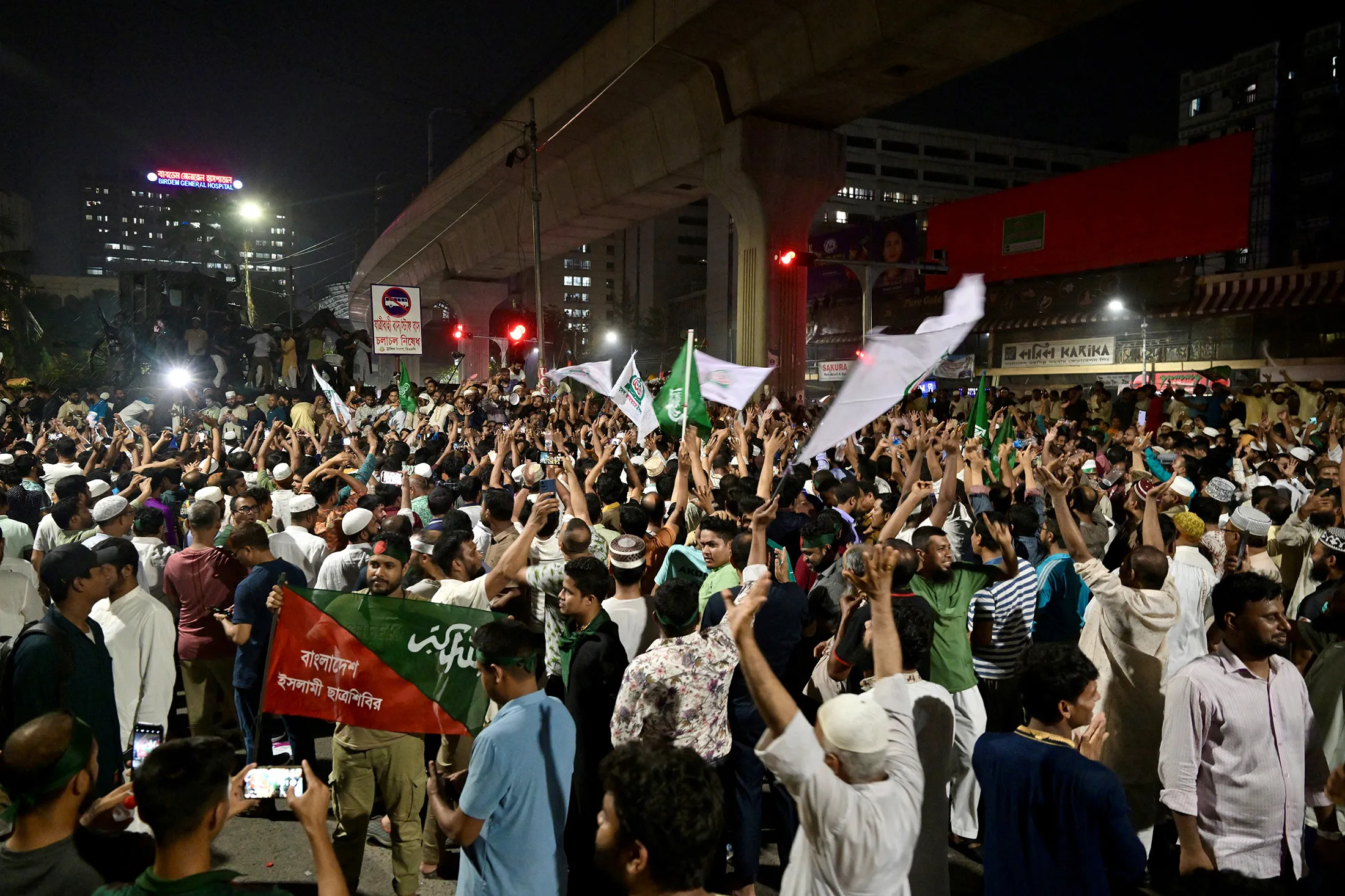 Bangladeshis celebrate after the interim government officially banned all activities of the Awami League&nbsp;under the Anti-Terrorism Act,&nbsp;in Dhaka on May 10.
