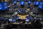 Traders work on the floor of the New York Stock Exchange (NYSE) in New York,U.S., on Friday, Nov. 23, 2018.