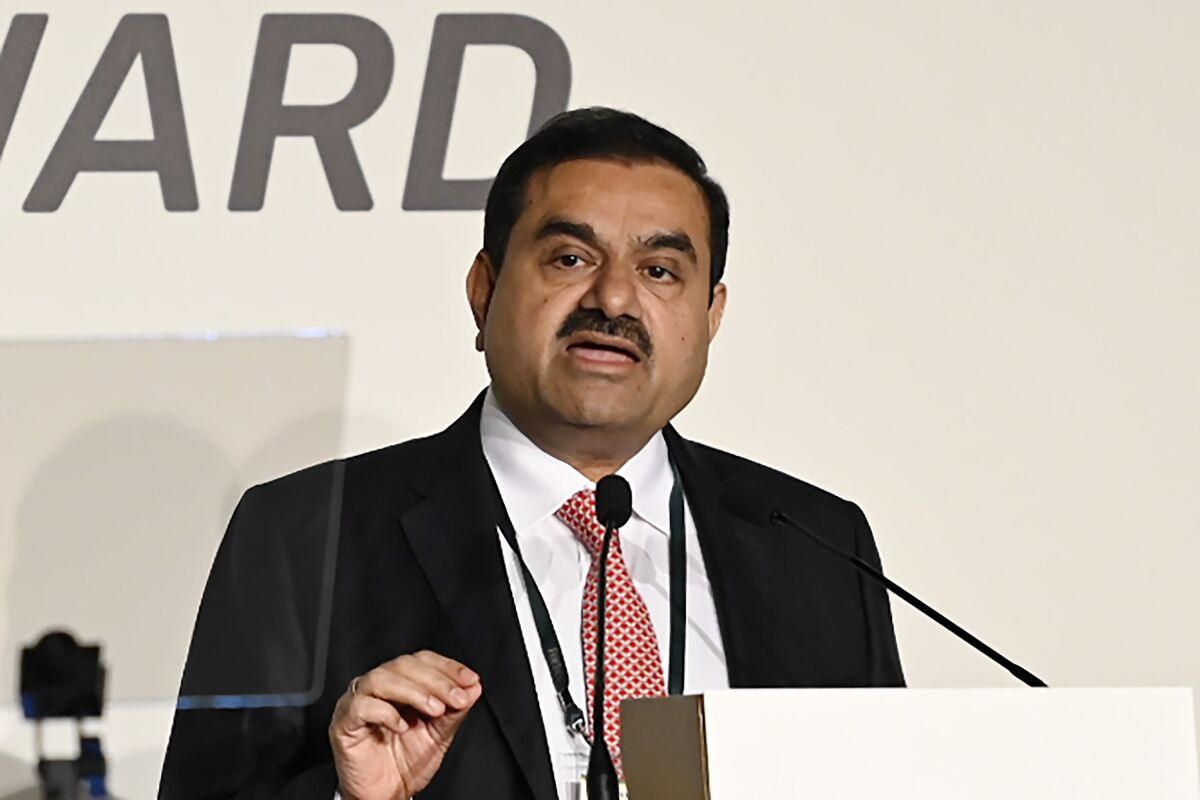 india's adani group shares plunge, extend rout from hindenburg research report - bloomberg