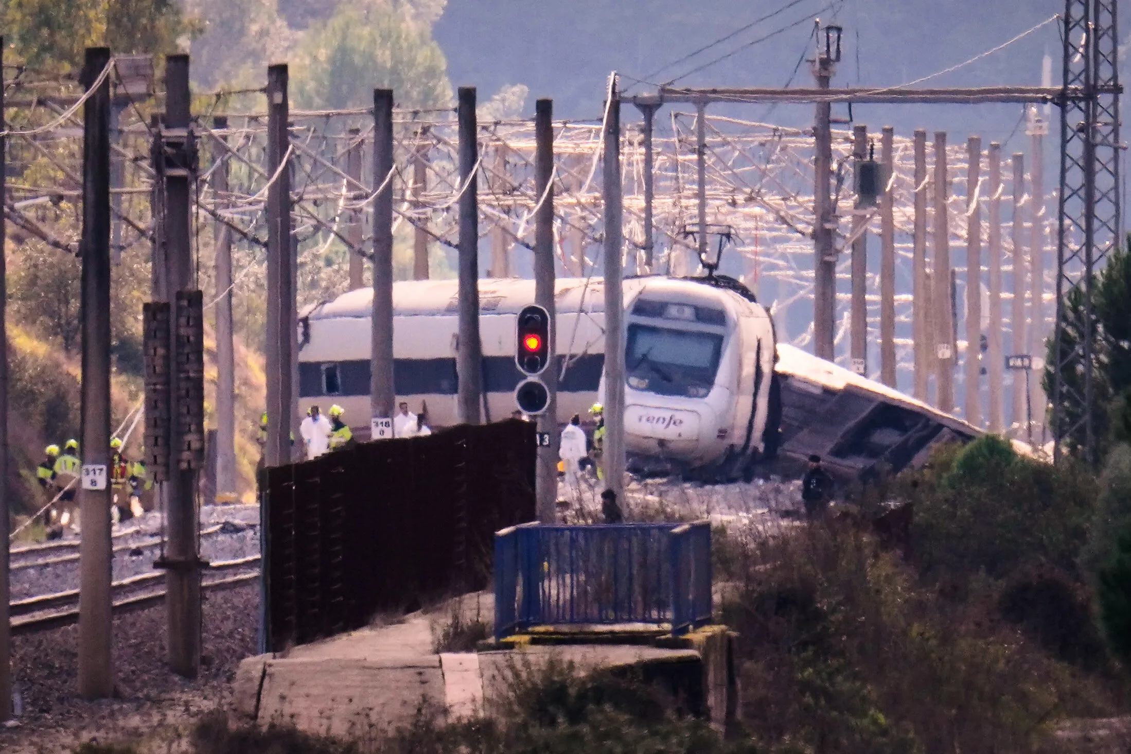 Emergency crews work at the site of a train collision in Adamuz, Spain, on Jan. 19.
