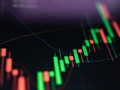 Close up growth candle graph on digital screen.