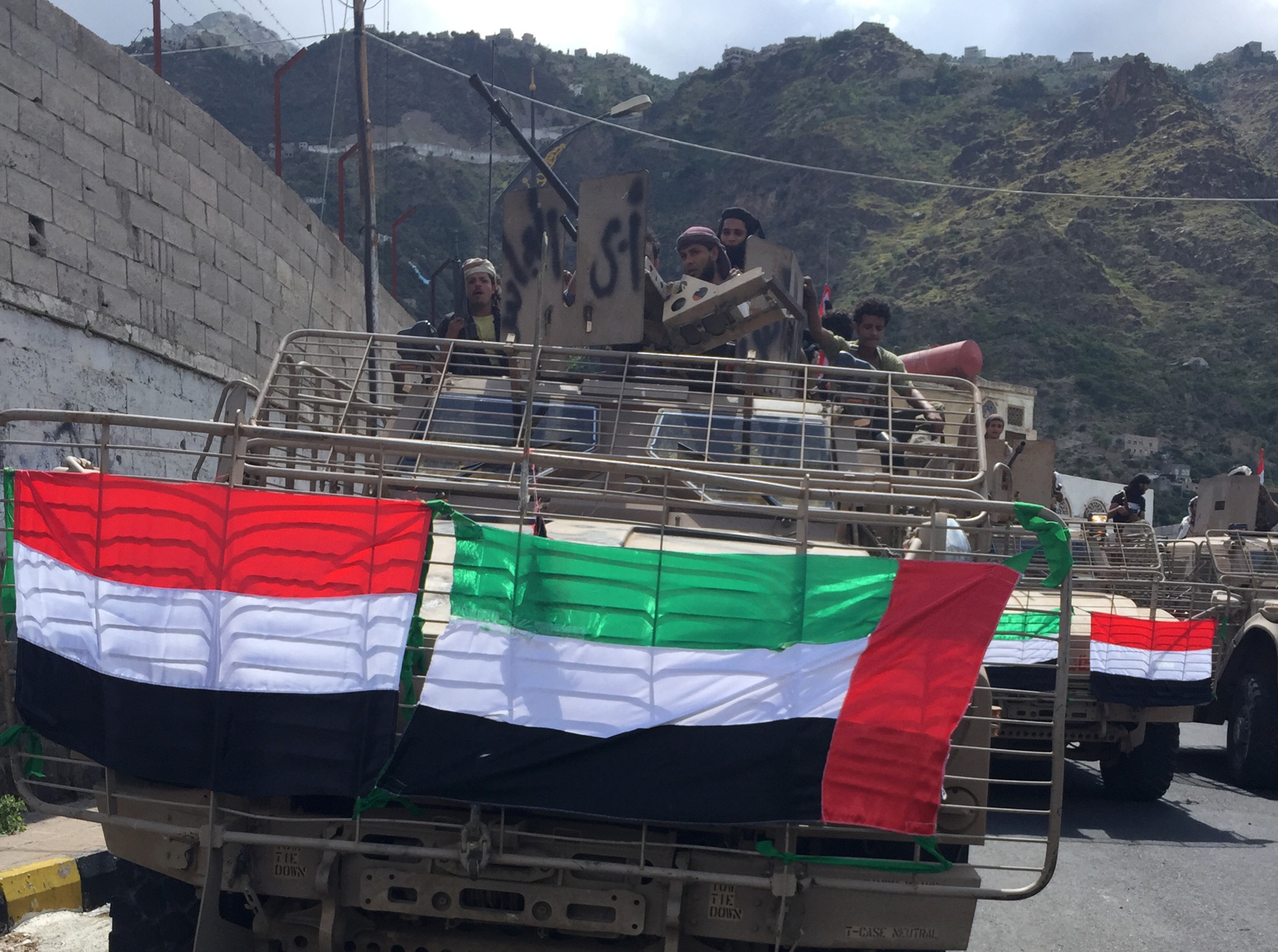 Abu Al-Abbass men celebrate the arrival of three armored vehicles presented by the U.A.E to the city of Taiz in 2015.