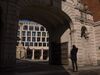 A member of the public stands outside the London Stock Exchange (LSE) in London, U.K., on Monday, March 23, 2020. The U.K. stepped in to shore up the country's rail operators after Prime Minister Boris Johnson warned Britons they face "tougher measures" to fight the coronavirus outbreak, including a potential lockdown if they continue to ignore calls to stop social gatherings.