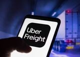 In this photo illustration, the Uber Freight logo is seen