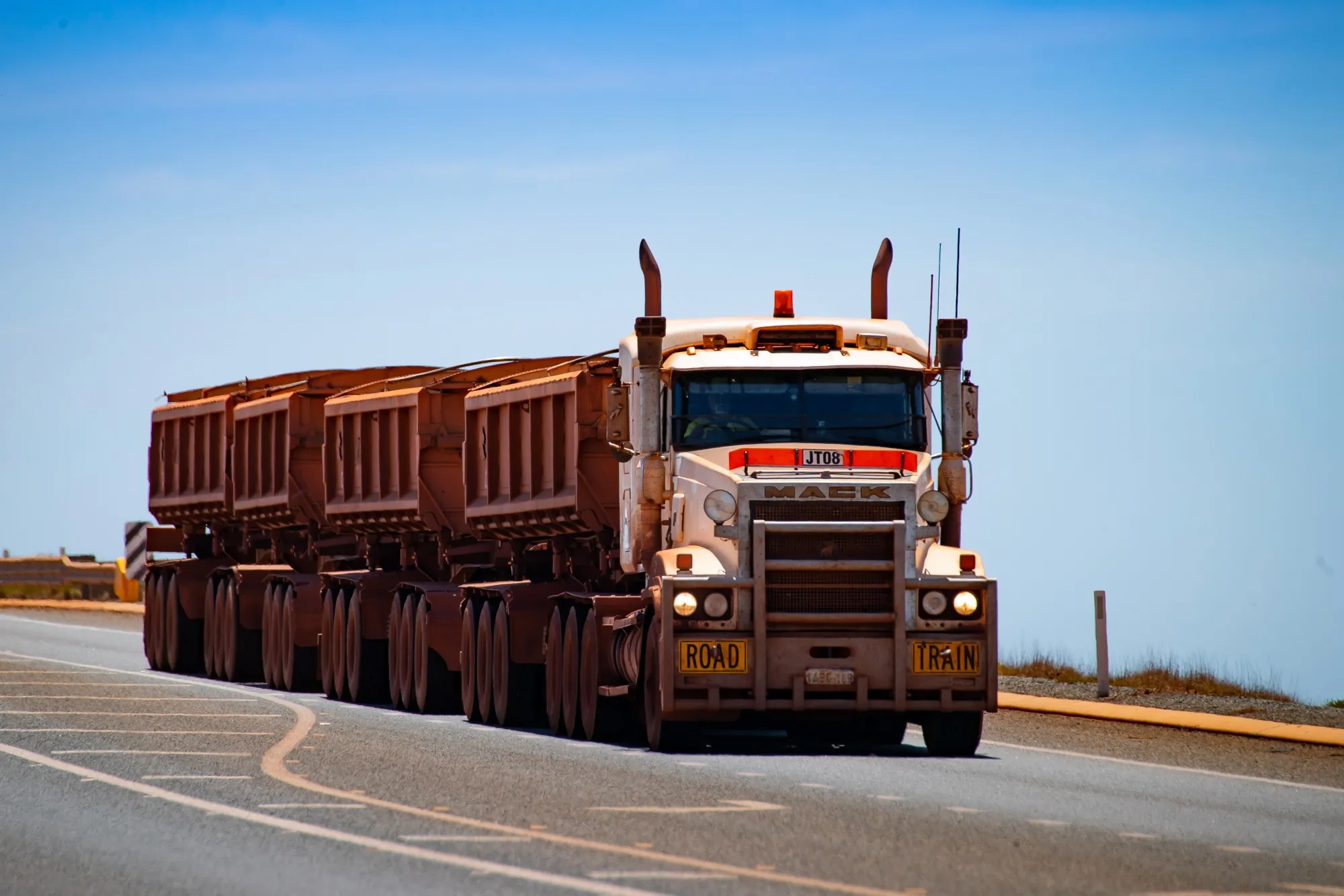 Wagons Of Iron Ore Make Their Way To Port By Rail And Road