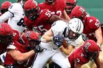 A Yale Bulldogs player is tackled during a game against the Harvard Crimson at Fenway Park in 2018.