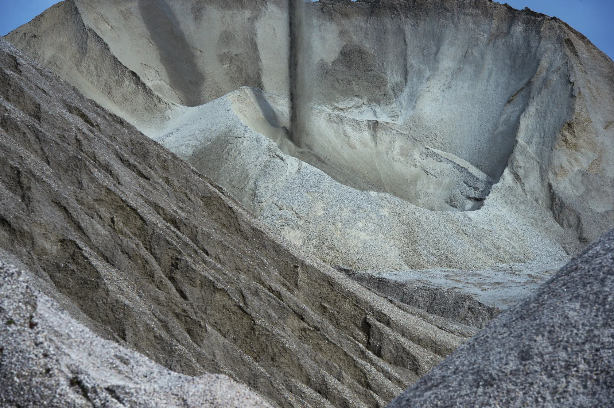 Stockpiles of lithium ore