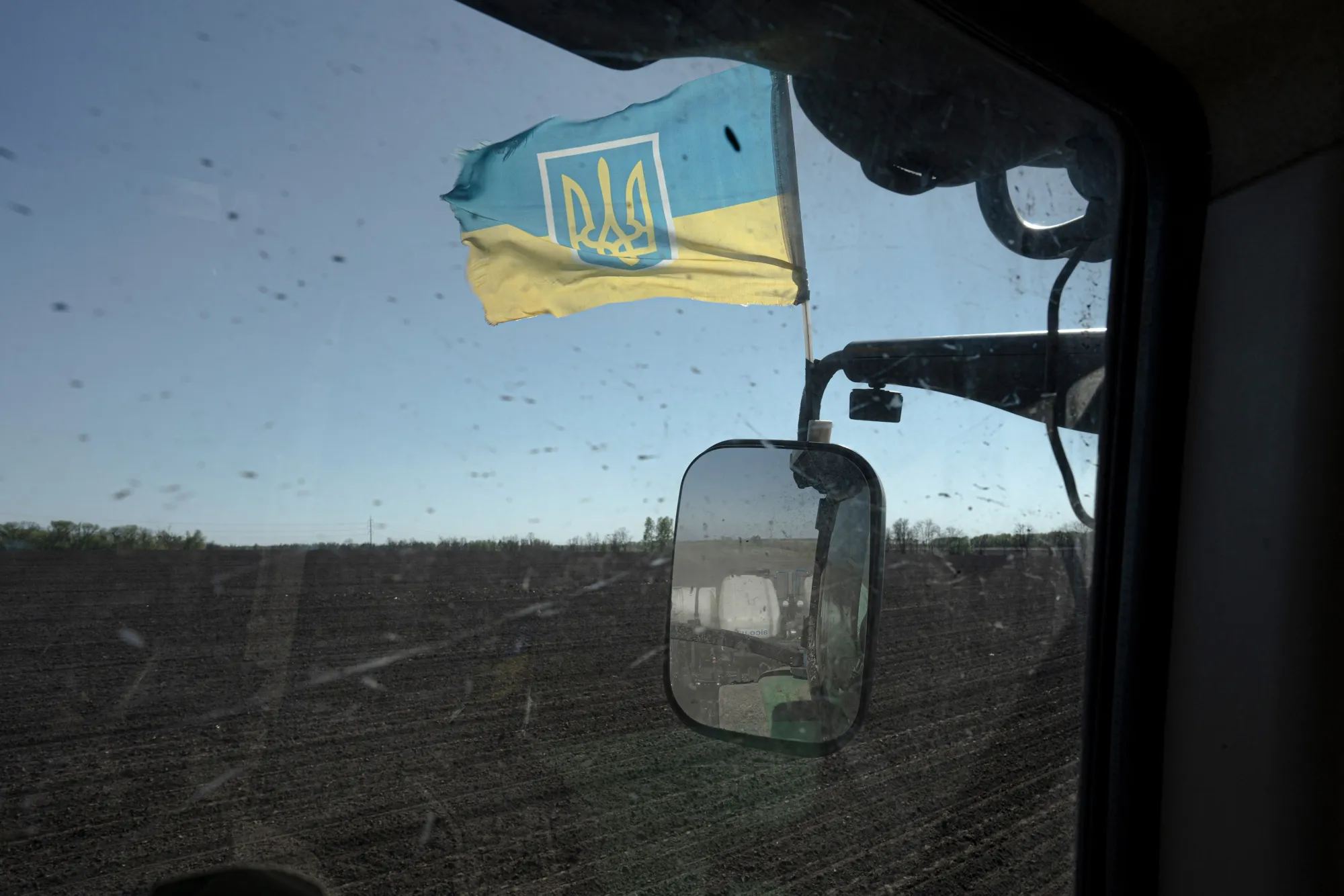 A Ukrainian flag on a tractor on a farm in Yemchykha, Ukraine.&nbsp;Talks for exporting Ukraine’s grain continue today.
