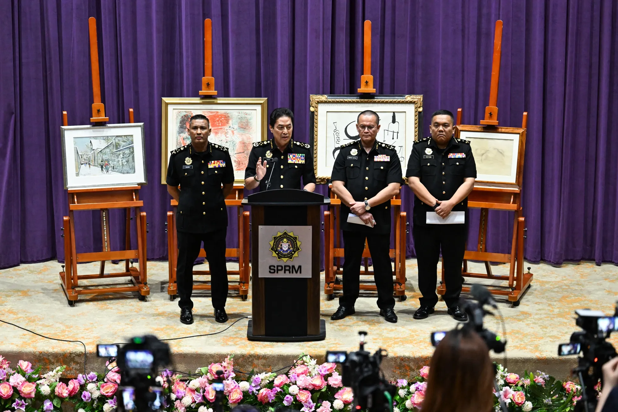 Malaysia’s Anti-Corruption Commission Chief Commissioner Azam Baki speaks in front of artworks by Maurice Utrillo, Pablo Picasso, Joan Miro and Balthus linked to 1MDB asset recovery at the MACC headquarters in Putrajaya, on May 6.