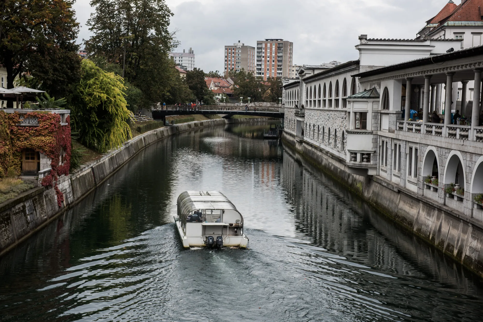 A sightseeing boat travels along the Ljubljanica River in Ljubljana, Slovenia, on Monday, Oct. 10, 2016. Slovenia's Finance Minister Mateja Vranicar Erman said last month that new spending priorities for 2017 and 2018 include infrastructure, job creation, improved health care and increased security.