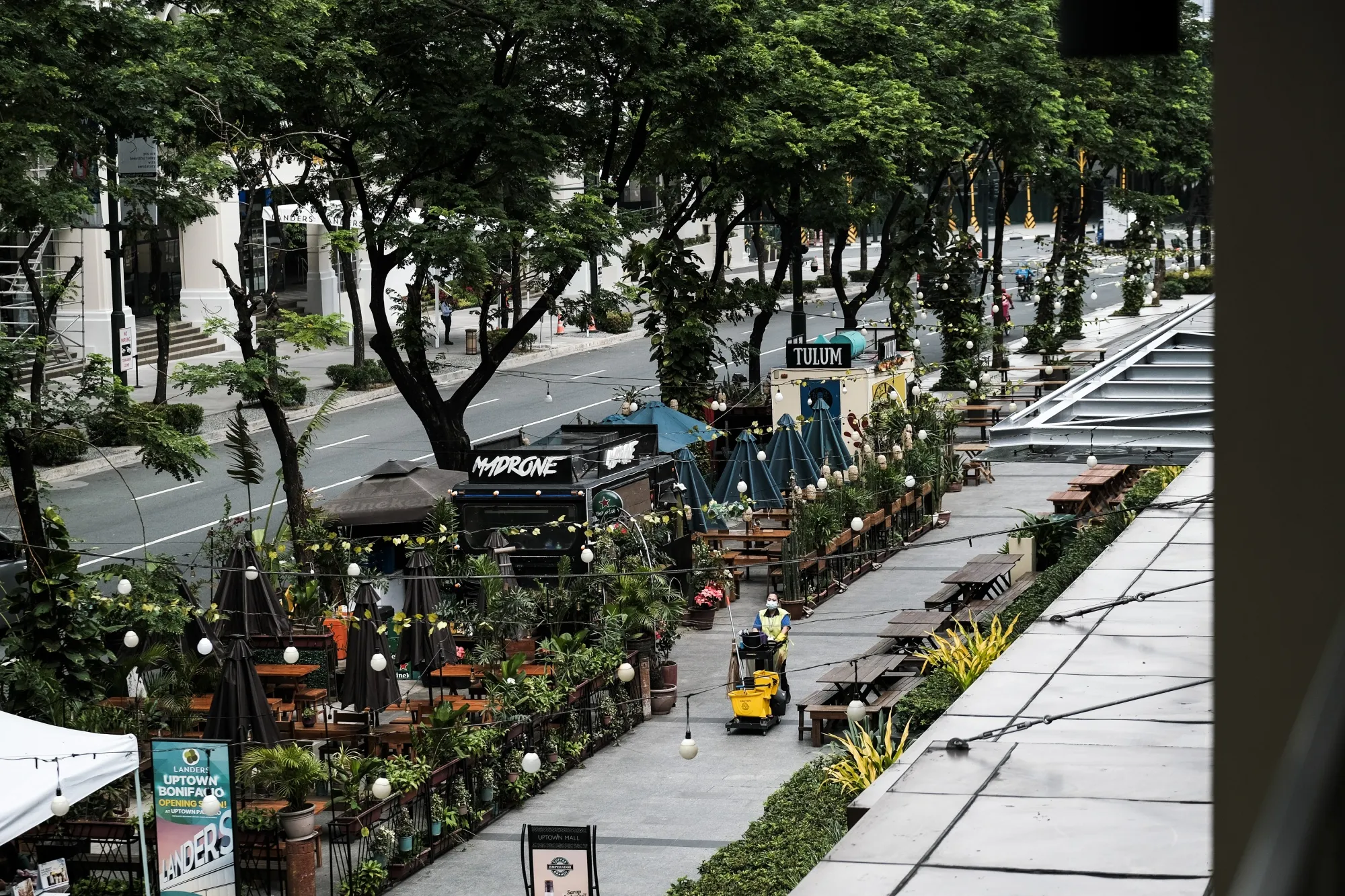 A worker walks through a public area in Taguig City, Metro Manila, the Philippines.