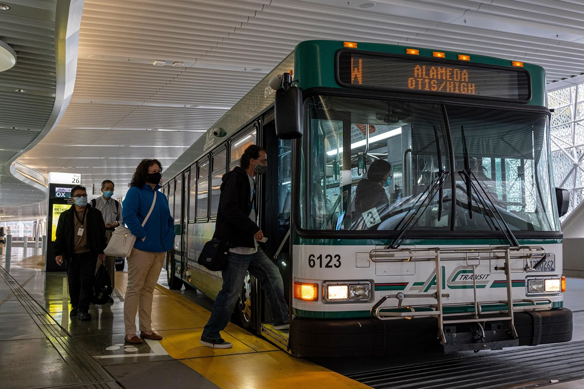 San Francisco commuters&nbsp;board a bus in the Salesforce Transit Center on June 9.&nbsp;