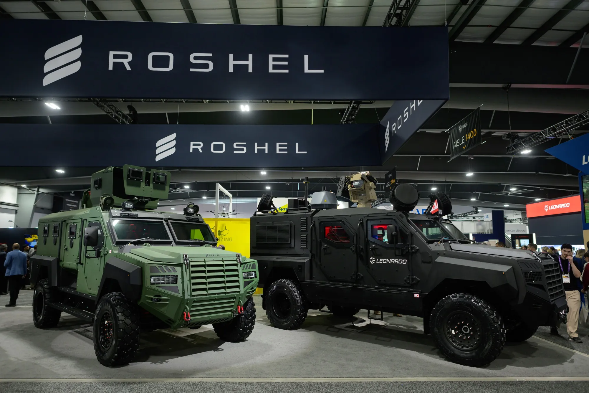 Military vehicles at the Roshel booth at a trade show in Ottawa.
