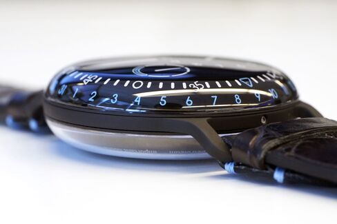 The body is two domes joined on a black titanium center plate.