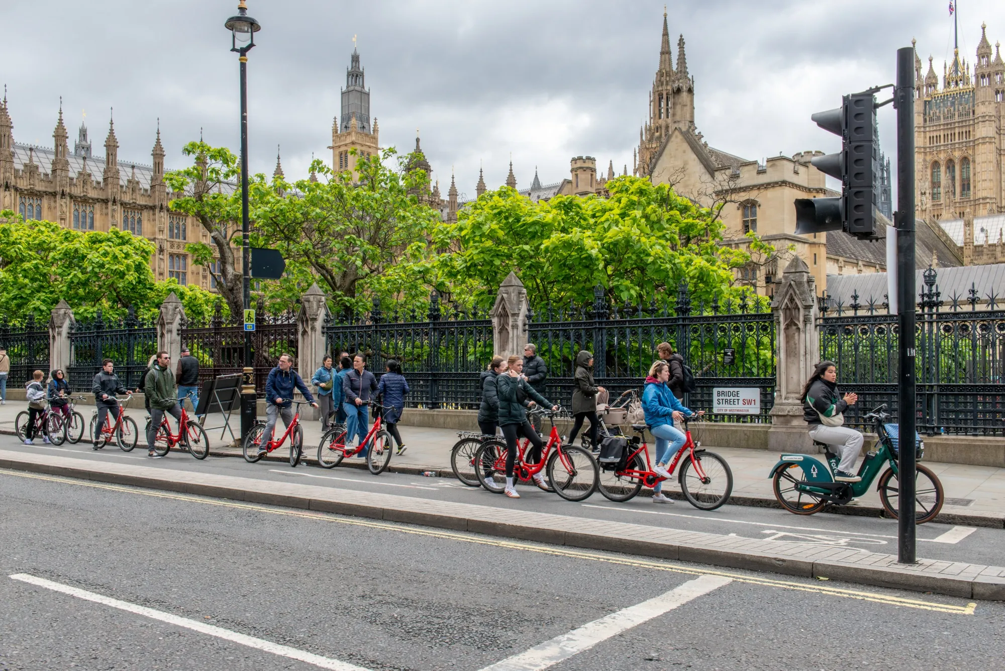 Cyclists wait in a cycle lane at a junction on Bridge Street in view of the Houses of Parliament in London, UK, on Monday, June 10, 2024.&nbsp;