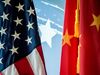 The Chinese and US national flags are seen during a promotional event in Beijing on June 30, 2017. / AFP PHOTO / FRED DUFOUR (Photo credit should read FRED DUFOUR/AFP/Getty Images)