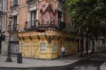 A pedestrian walks along Calle Mayor past shuttered stores and cafes in Madrid, on&nbsp;May 7.