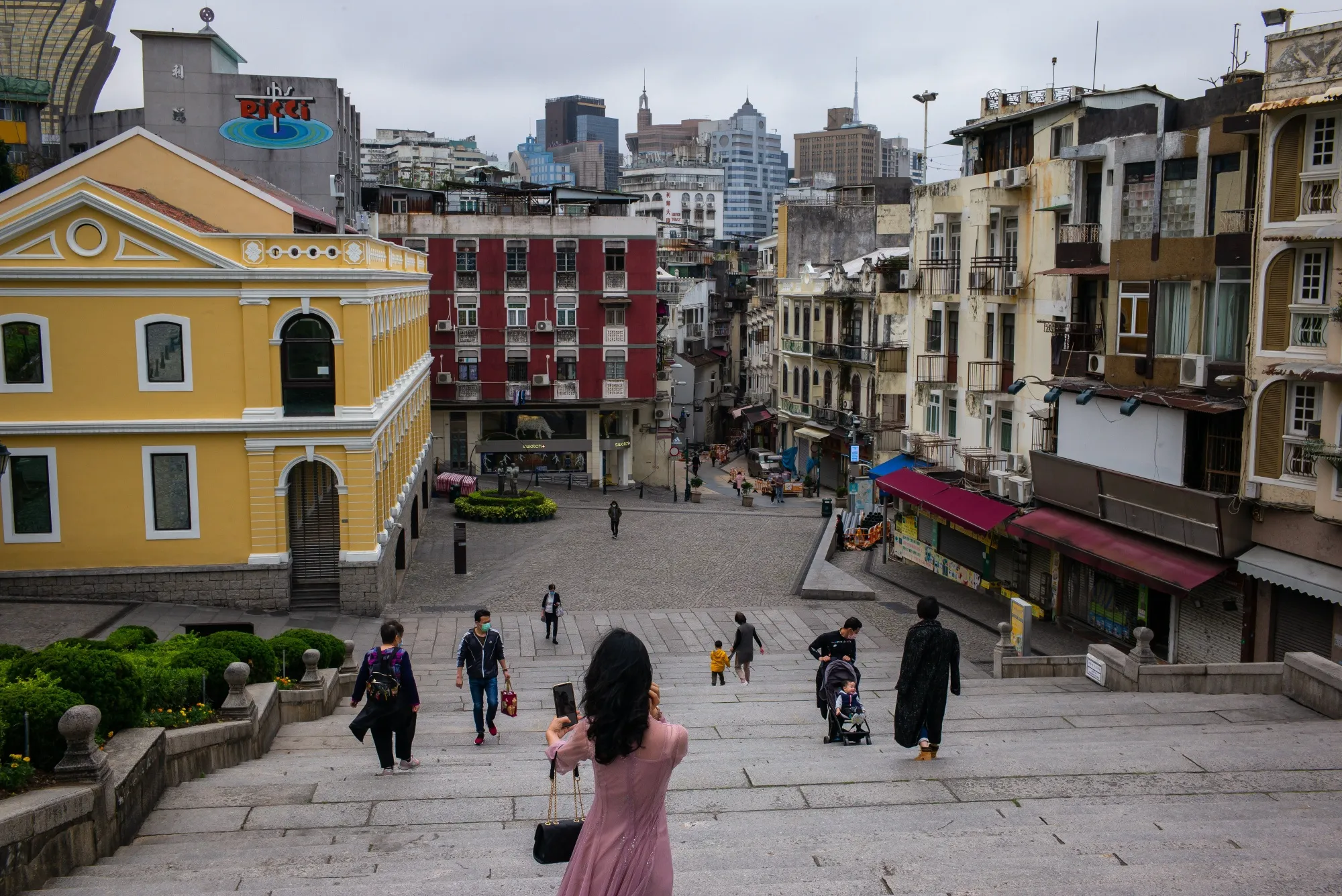 A woman takes a selfie photograph on the steps at the Ruins of Saint Paul's in Macau on March 3.